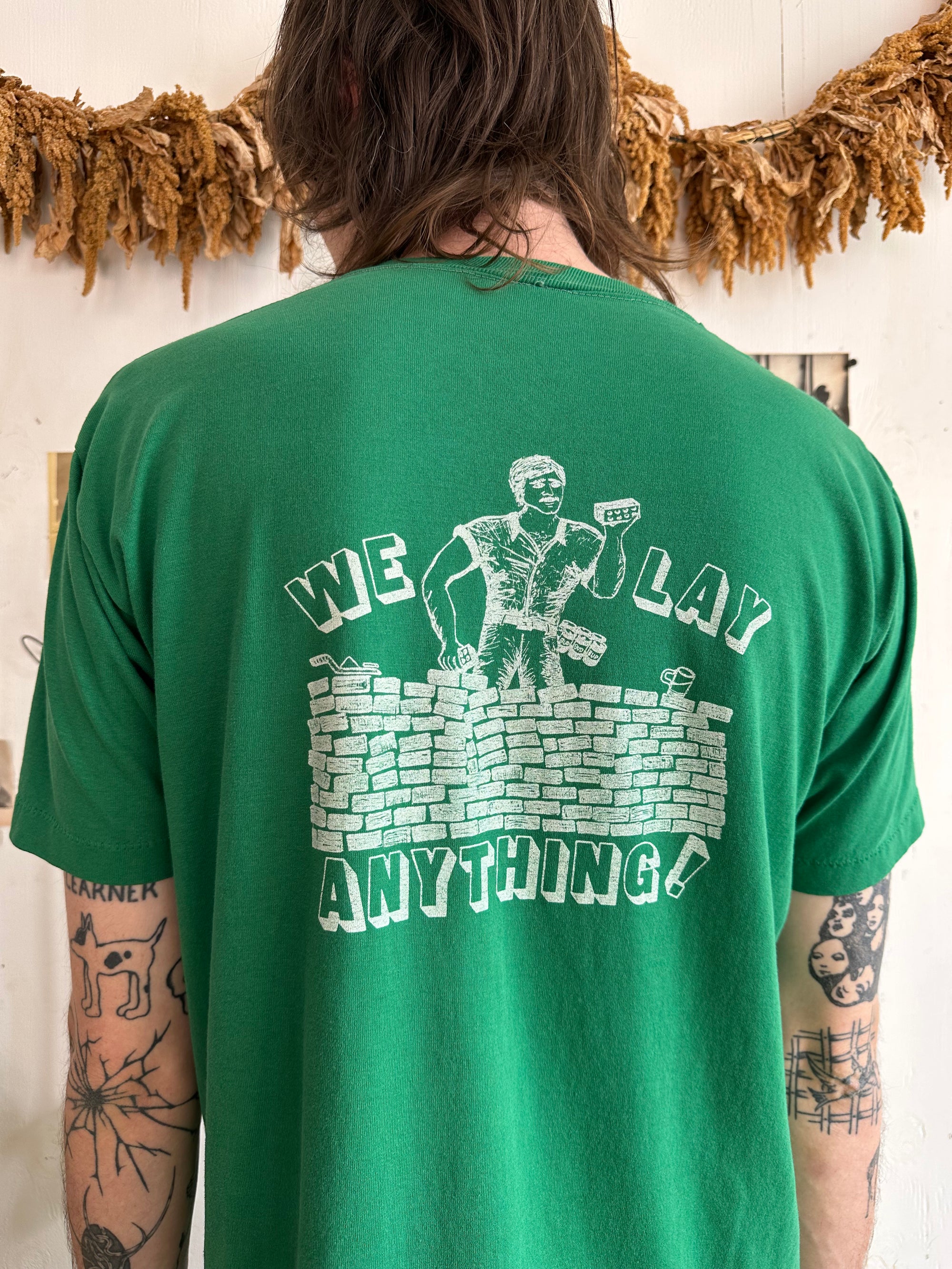 1970s We Lay Anything Pocket Tee